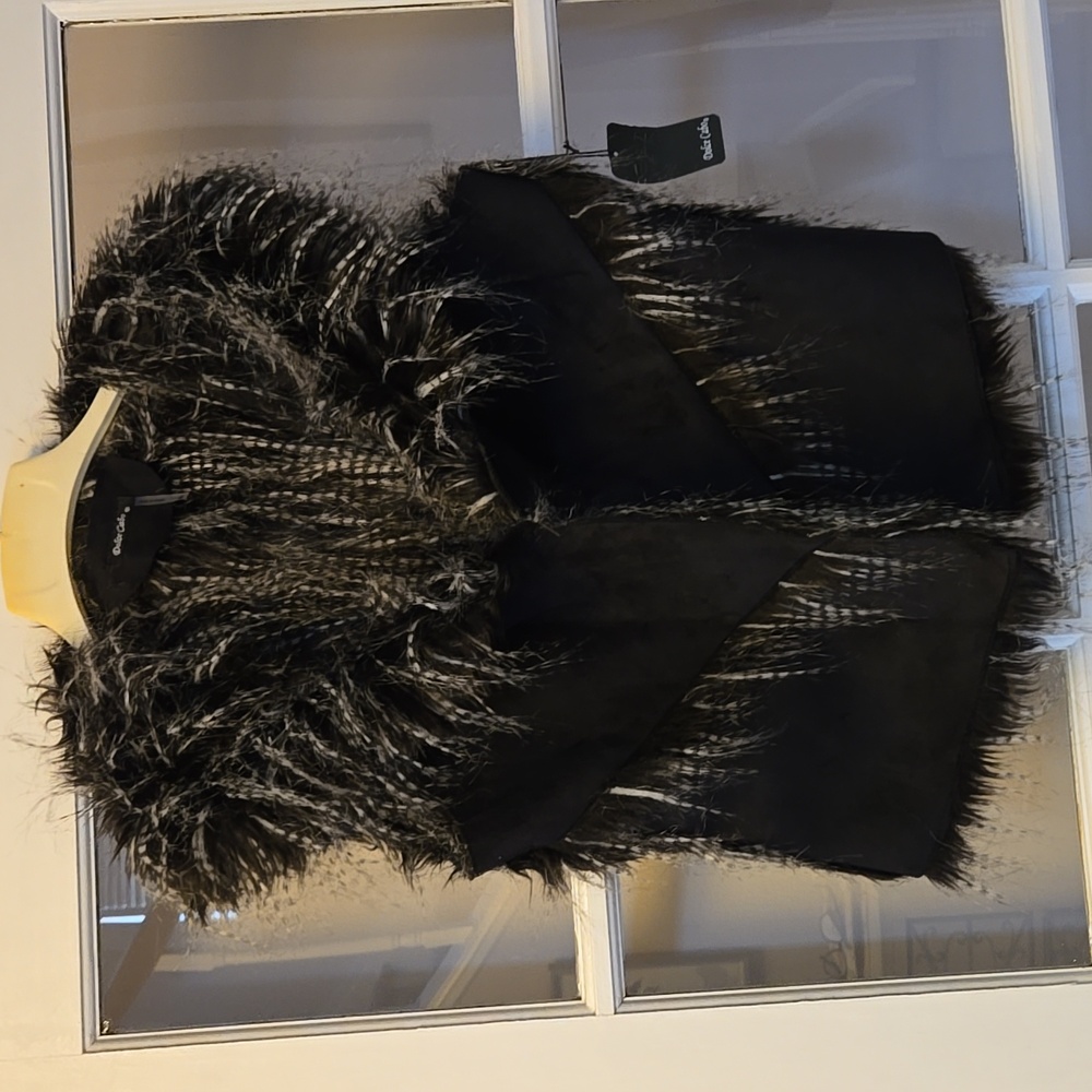 NWT Dolce Cabo faux fur vest. Marked as XL but fits medium